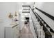Bright entryway featuring stylish decor, hardwood floors, and staircase leading to the second floor at 1061 S Yampa St # C, Aurora, CO 80017