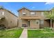 Charming townhome featuring a cozy front porch and well-maintained lawn at 1061 S Yampa St # C, Aurora, CO 80017