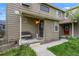 Inviting front porch with seating area, offering a warm welcome to this lovely home at 1061 S Yampa St # C, Aurora, CO 80017