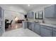 Updated kitchen with stainless steel appliances, light blue cabinets and tile flooring that flow through to living spaces at 1061 S Yampa St # C, Aurora, CO 80017