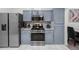 Modern kitchen appliances including a stainless steel range, microwave, and refrigerator at 1061 S Yampa St # C, Aurora, CO 80017