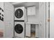 Efficient laundry room with stacked washer and dryer plus built-in countertop at 1061 S Yampa St # C, Aurora, CO 80017