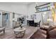 Open-concept living space with vaulted ceilings, modern furniture, and seamless flow to the kitchen at 1061 S Yampa St # C, Aurora, CO 80017