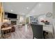 Open living space with modern fireplace, adjacent dining area, and sliding glass doors to the patio at 1061 S Yampa St # C, Aurora, CO 80017