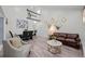 Bright and airy living space with hardwood floors, stylish furniture, and an open dining area at 1061 S Yampa St # C, Aurora, CO 80017