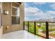 Balcony with views of greenery and city buildings at 7700 E 29Th Ave # 405, Denver, CO 80238