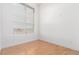 Sunlit bedroom with a large window, light hardwood floors and neutral paint at 7700 E 29Th Ave # 405, Denver, CO 80238