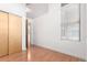 Bedroom with hardwood floors, closet and neutral paint at 7700 E 29Th Ave # 405, Denver, CO 80238