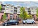 Apartment building on a rainy day with parking in front at 7700 E 29Th Ave # 405, Denver, CO 80238
