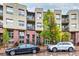 Apartment building on a rainy day with parking in front at 7700 E 29Th Ave # 405, Denver, CO 80238