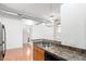Kitchen with bar sink area, stainless steel appliances and modern lighting at 7700 E 29Th Ave # 405, Denver, CO 80238