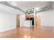 A bright open floor plan kitchen area featuring hardwood floors, wood cabinets, a modern appliance package at 7700 E 29Th Ave # 405, Denver, CO 80238