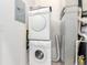 Laundry room featuring stacked washer and dryer appliances at 7700 E 29Th Ave # 405, Denver, CO 80238