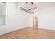 Bright living room featuring hardwood floors and exposed ductwork, offering a modern, industrial aesthetic at 7700 E 29Th Ave # 405, Denver, CO 80238