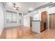 Bright living room with hardwood floors, large windows, and open floor plan at 7700 E 29Th Ave # 405, Denver, CO 80238