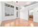 Bright open floor plan with lots of light, hardwood floors and view to bathroom vanity at 7700 E 29Th Ave # 405, Denver, CO 80238