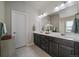 Bathroom featuring a double vanity with plenty of storage space at 11926 Olive St, Thornton, CO 80233