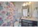 Bathroom featuring a shower and floral shower curtain at 11926 Olive St, Thornton, CO 80233