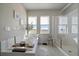 Bright bathroom featuring a bathtub and walk-in shower with white subway tiles at 11926 Olive St, Thornton, CO 80233