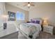 Bedroom featuring a large window with great views and tufted headboard at 11926 Olive St, Thornton, CO 80233