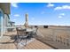 Outdoor deck with seating and dining area offers a great view and an umbrella for shade at 11926 Olive St, Thornton, CO 80233