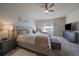 Spacious main bedroom features a ceiling fan and a large window at 11926 Olive St, Thornton, CO 80233