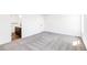 Spacious, bright bedroom featuring plush gray carpeting and lots of natural light at 4451 Soapberry Pl, Castle Rock, CO 80108