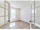 Bright bedroom featuring hardwood floors and a large window at 4451 Soapberry Pl, Castle Rock, CO 80108
