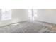 Bright bedroom with gray carpet, white walls, and lots of natural light from large windows at 4451 Soapberry Pl, Castle Rock, CO 80108