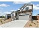 Charming two-story home with stone accents, two car garage, and new landscaping at 4451 Soapberry Pl, Castle Rock, CO 80108