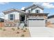 Beautiful two-story home boasts stone accents, two car garage, and new landscaping at 4451 Soapberry Pl, Castle Rock, CO 80108