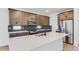 Well-appointed kitchen with stainless steel appliances, mosaic backsplash, and quartz countertops at 4451 Soapberry Pl, Castle Rock, CO 80108