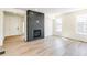 Open living room features hardwood floors and a modern fireplace at 4451 Soapberry Pl, Castle Rock, CO 80108