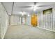 Finished basement with carpet and wood paneling offers potential living space at 7101 Alan Dr, Denver, CO 80221