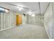 Spacious finished basement features updated carpet and a vintage wooden dresser at 7101 Alan Dr, Denver, CO 80221