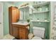 A clean bathroom with storage and shelving at 7101 Alan Dr, Denver, CO 80221