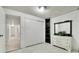 Bedroom featuring closet space and dresser with mirror at 7101 Alan Dr, Denver, CO 80221