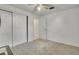Carpeted bedroom with white walls and a ceiling fan at 7101 Alan Dr, Denver, CO 80221