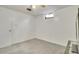 Carpeted room with a small window and ceiling fan at 7101 Alan Dr, Denver, CO 80221