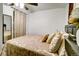 Comfortable bedroom featuring neutral tones, a ceiling fan, and a decorative mirror at 7101 Alan Dr, Denver, CO 80221