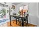 Charming dining area with natural light, and hardwood floors at 7101 Alan Dr, Denver, CO 80221