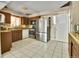 A full kitchen view featuring stainless steel appliances and abundant cabinet space at 7101 Alan Dr, Denver, CO 80221