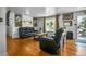 Cozy living room features hardwood floors, and lots of natural light at 7101 Alan Dr, Denver, CO 80221