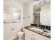 Bright bathroom features granite countertop, a framed mirror, and ceramic tile floors at 15217 Xenia St, Thornton, CO 80602