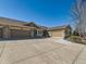 Home with multi-car garages and wide driveway for ample parking at 15217 Xenia St, Thornton, CO 80602