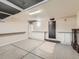 Spacious garage features epoxy floors, ample storage, and utility sink at 15217 Xenia St, Thornton, CO 80602