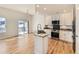 Well-lit modern kitchen with stainless steel appliances and granite countertops at 15217 Xenia St, Thornton, CO 80602