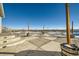 Large back patio with checkered concrete and distant views at 9880 E 160Th Pl, Brighton, CO 80602