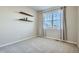 Charming bedroom with window, floating shelves, and neutral-toned decor at 9880 E 160Th Pl, Brighton, CO 80602