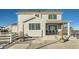 Exterior view of two-story house, showing back patio at 9880 E 160Th Pl, Brighton, CO 80602